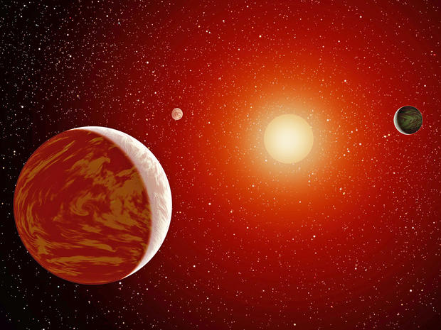 alt: Ilustrační obrázek: Umělecká představa červeného trpaslíka, kolem nějž obíhají tři planety. Zdroj Wikimedia Commons, autor NASA/JPL-Caltech, volné dílo / Public Domain.