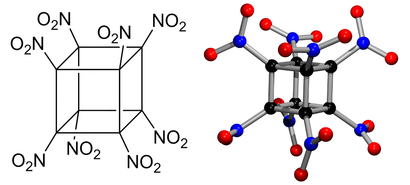 alt: Oktanitrokuban, energetická sloučenina poprvé syntetizovaná v roce 2000. Černě jsou označeny atomy uhlíku, červeně kyslíku a modře dusíku. Ilustrace: Jan Kotek a Petr Slavíček.